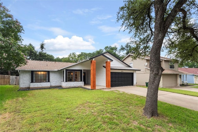 12416 Cassady Dr, Austin, TX 78727 - view of front facade with concrete driveway and an attached garage