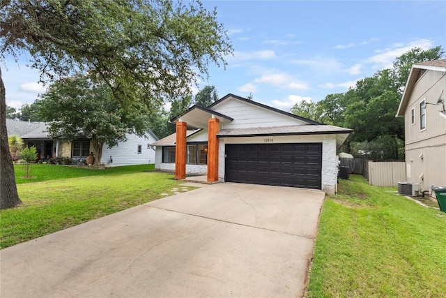 12416 Cassady Dr, Austin, TX 78727 - view of front of property with an attached garage and driveway
