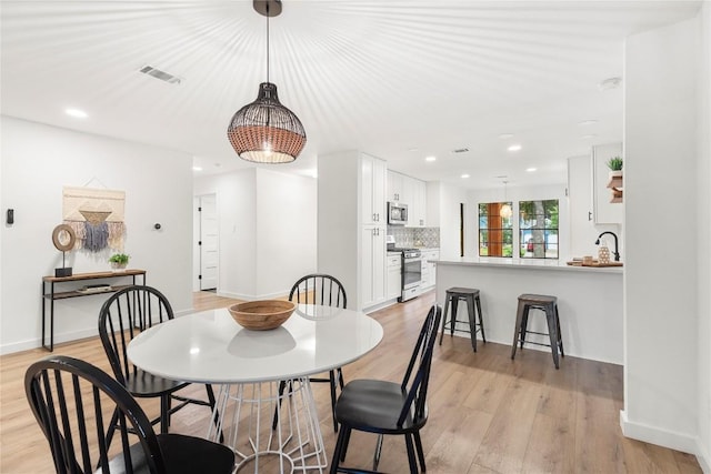 12416 Cassady Dr, Austin, TX 78727 - dining area with light wood-style flooring and recessed lighting