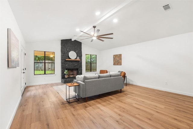 12416 Cassady Dr, Austin, TX 78727 - living room featuring ceiling fan, light wood-style floors, a fireplace, beam ceiling, and high vaulted ceiling