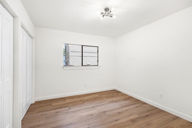 12416 Cassady Dr, Austin, TX 78727 - unfurnished bedroom featuring light wood finished floors and a closet