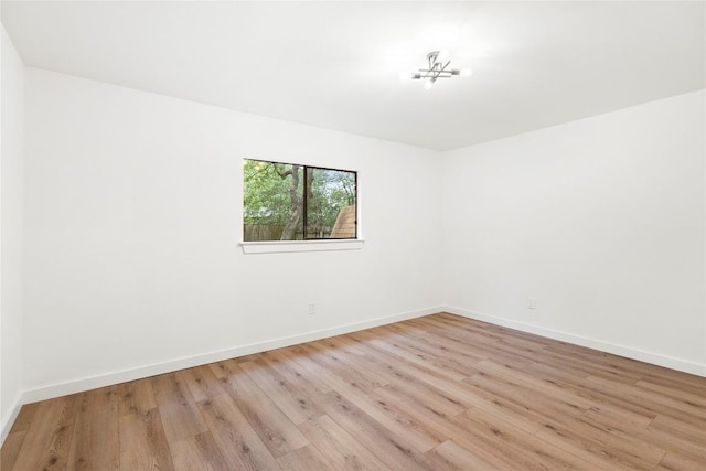 12416 Cassady Dr, Austin, TX 78727 - empty room featuring wood finished floors and baseboards