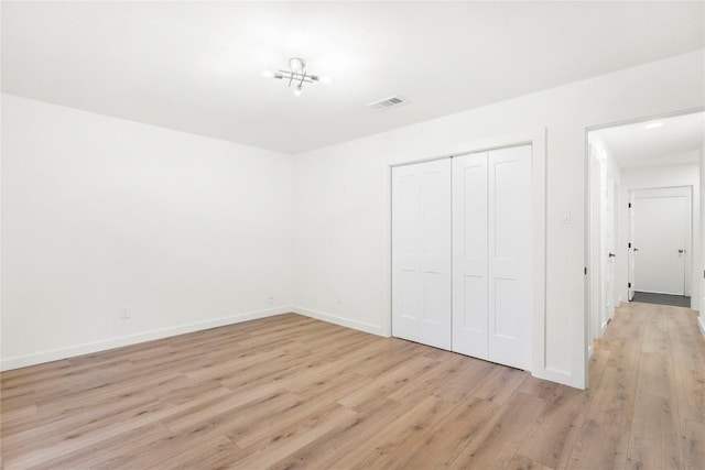 12416 Cassady Dr, Austin, TX 78727 - unfurnished bedroom with light wood-style flooring and a closet