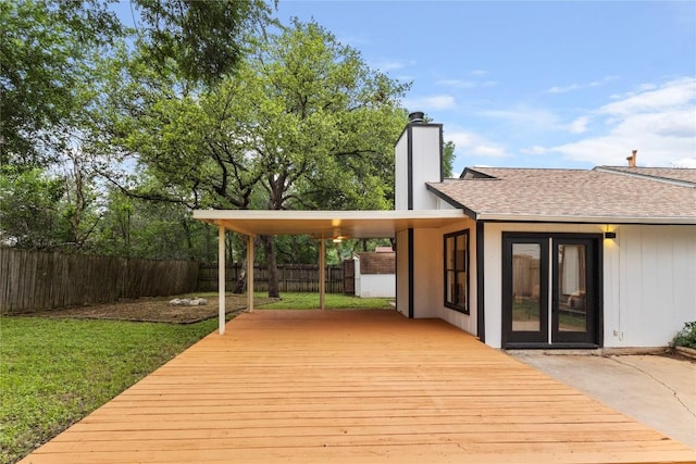 12416 Cassady Dr, Austin, TX 78727 - wooden terrace with a fenced backyard and an attached carport