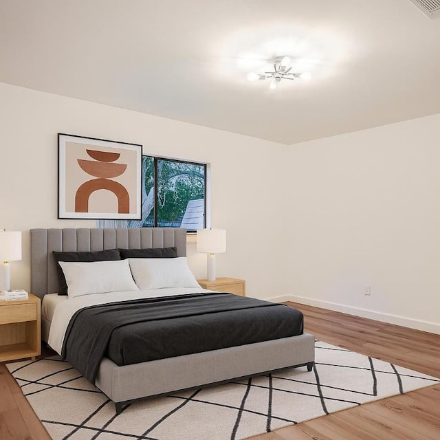 12416 Cassady Dr, Austin, TX 78727 - bedroom with light wood-style floors and baseboards