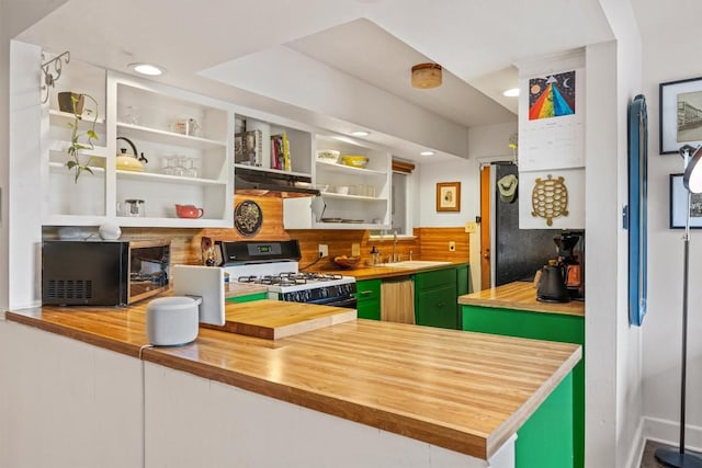 5201 Harvest Cir, Austin, TX 78745 - kitchen featuring gas range gas stove, wooden counters, green cabinetry, under cabinet range hood, and open shelves
