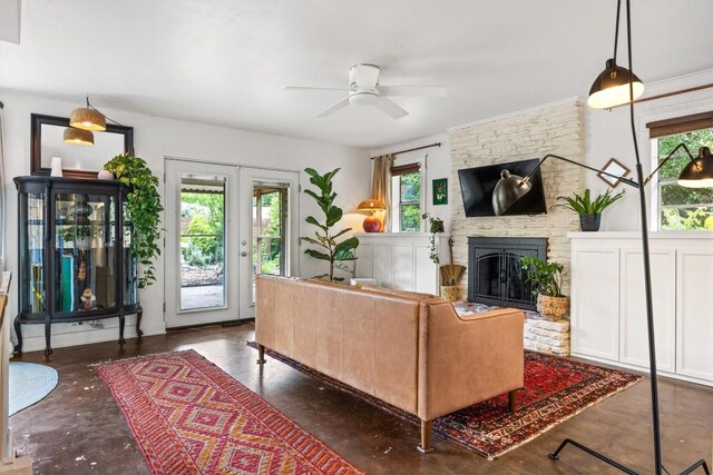5201 Harvest Cir, Austin, TX 78745 - living area with ceiling fan, concrete flooring, and a fireplace