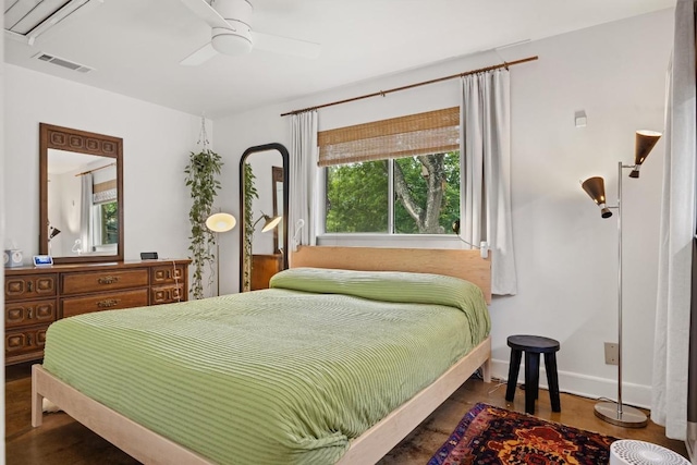 5201 Harvest Cir, Austin, TX 78745 - bedroom with multiple windows, wood finished floors, and ceiling fan
