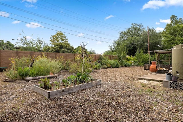 5201 Harvest Cir, Austin, TX 78745 - fenced backyard with a garden and a patio area