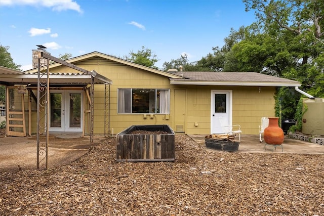 5201 Harvest Cir, Austin, TX 78745 - rear view of house with a patio area, french doors, and an outdoor fire pit