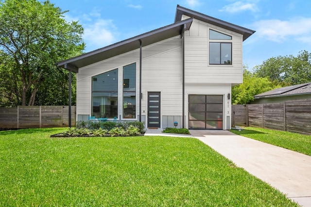611 Gaylor St Unit 2, Austin, TX 78752 - back of house with a garage and concrete driveway