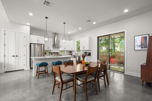 611 Gaylor St Unit 2, Austin, TX 78752 - dining space with finished concrete floors and recessed lighting