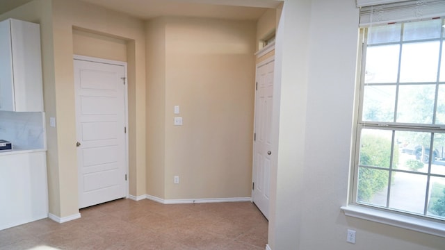 1024 Chad Loop, Round Rock, TX 78665 - hall with plenty of natural light and light tile patterned flooring