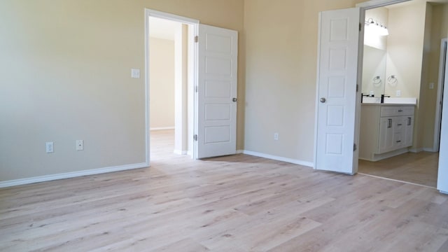 1024 Chad Loop, Round Rock, TX 78665 - unfurnished bedroom with light wood finished floors and ensuite bathroom