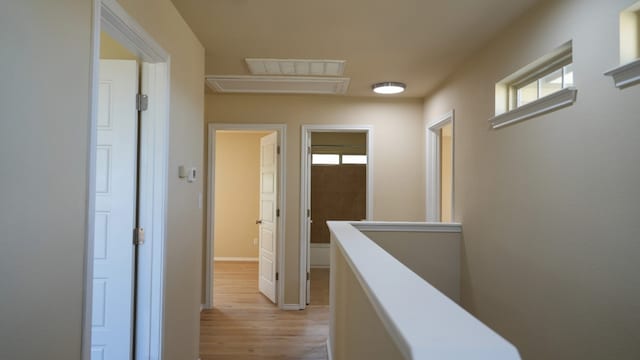 1024 Chad Loop, Round Rock, TX 78665 - corridor featuring light wood finished floors, plenty of natural light, and an upstairs landing