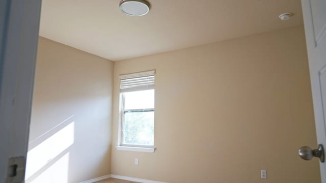 1024 Chad Loop, Round Rock, TX 78665 - unfurnished room featuring a smoke detector and baseboards