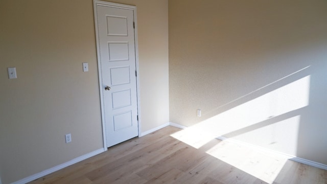 1024 Chad Loop, Round Rock, TX 78665 - unfurnished room featuring wood finished floors and baseboards