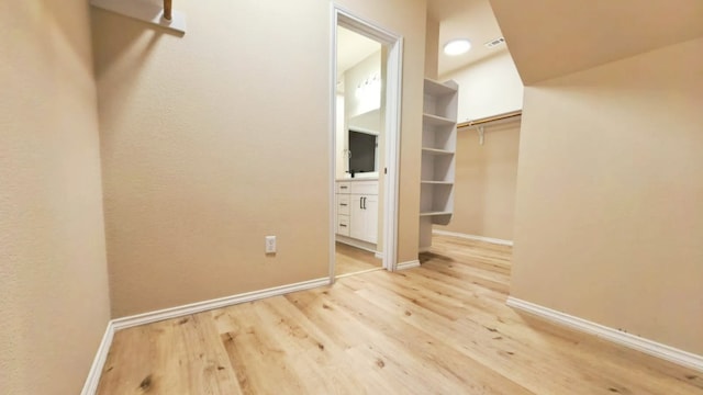 1024 Chad Loop, Round Rock, TX 78665 - walk in closet with wood finished floors