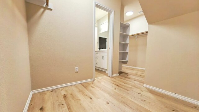 1024 Chad Loop, Round Rock, TX 78665 - walk in closet with wood finished floors