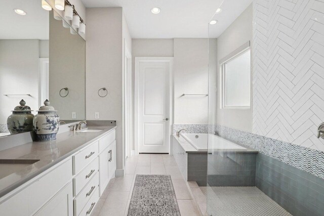 101 Cascading Water Pl, Austin, TX 78734 - bathroom featuring tile patterned flooring, double vanity, a garden tub, and recessed lighting