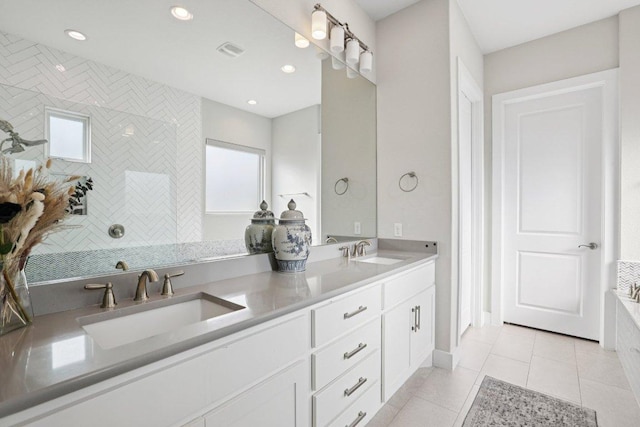 101 Cascading Water Pl, Austin, TX 78734 - full bath featuring double vanity, tile patterned flooring, recessed lighting, and walk in shower