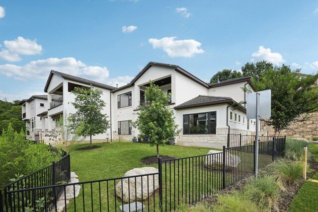 101 Cascading Water Pl, Austin, TX 78734 - back of property with stucco siding and stone siding