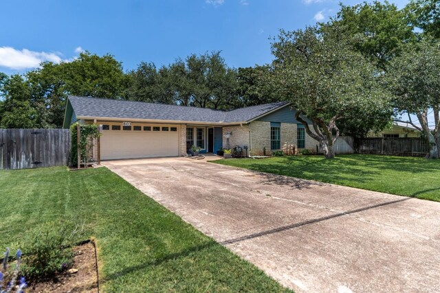 803 Lone Star Dr, Cedar Park, TX 78613 - single story home featuring an attached garage, concrete driveway, and brick siding