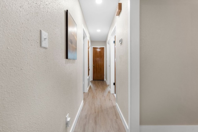 803 Lone Star Dr, Cedar Park, TX 78613 - hallway with a textured wall, light wood-style flooring, and recessed lighting