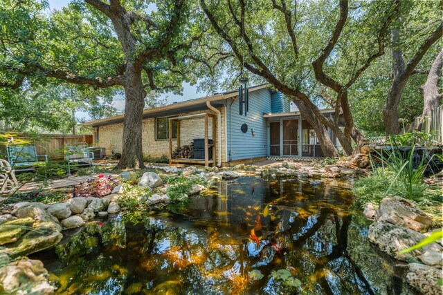 803 Lone Star Dr, Cedar Park, TX 78613 - back of property featuring a sunroom