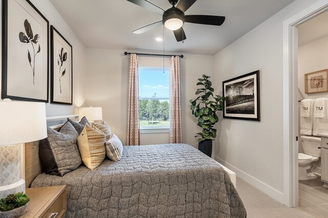9501 Wiggy Way, Austin, TX 78744 - bedroom featuring ensuite bath, light colored carpet, and a ceiling fan
