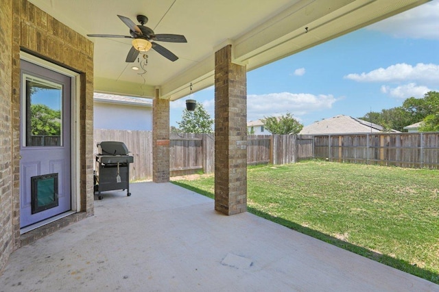 3200 Bravo Dr, Leander, TX 78641 - fenced backyard featuring ceiling fan, a patio area, and grilling area