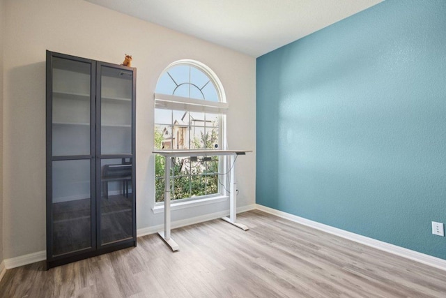 3200 Bravo Dr, Leander, TX 78641 - spare room featuring wood finished floors and baseboards