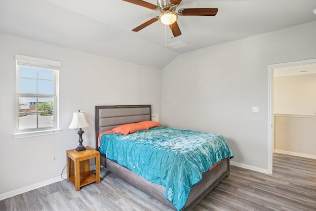 3200 Bravo Dr, Leander, TX 78641 - bedroom featuring wood finished floors, lofted ceiling, and ceiling fan