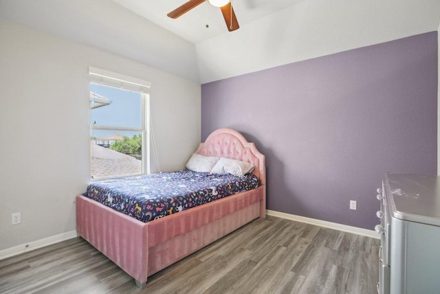 3200 Bravo Dr, Leander, TX 78641 - bedroom featuring wood finished floors, lofted ceiling, and a ceiling fan