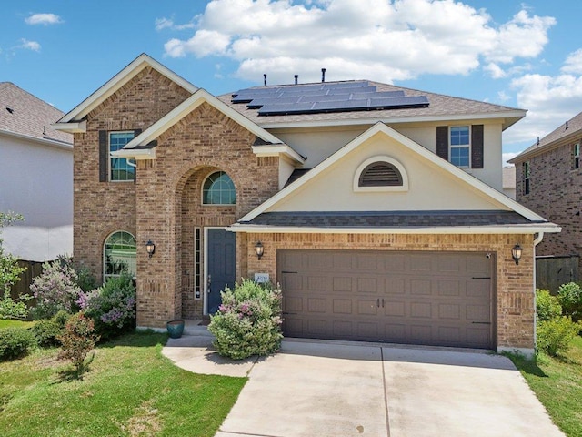 3200 Bravo Dr, Leander, TX 78641 - traditional home with brick siding, roof mounted solar panels, concrete driveway, and stucco siding