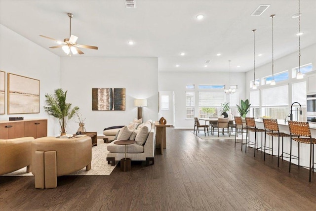 271 Eclipse Dr, Austin, TX 78737 - living area with dark wood finished floors, a ceiling fan, recessed lighting, and a chandelier