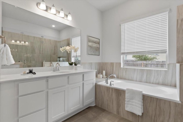 271 Eclipse Dr, Austin, TX 78737 - full bathroom featuring a bath, a stall shower, vanity, and tile patterned flooring