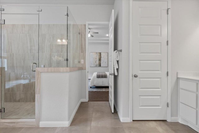 271 Eclipse Dr, Austin, TX 78737 - ensuite bathroom with vanity, a shower stall, a ceiling fan, and tile patterned floors