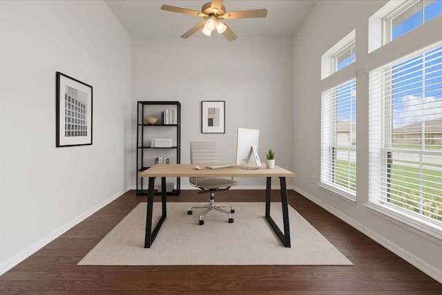 271 Eclipse Dr, Austin, TX 78737 - office space featuring healthy amount of natural light, dark wood-type flooring, ceiling fan, and radiator heating unit