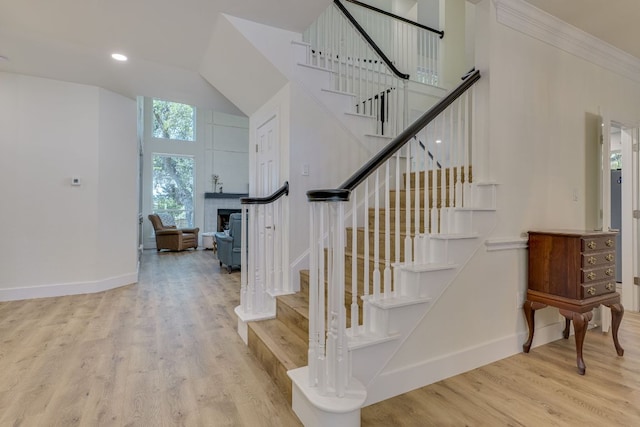 38 Cottondale Rd, The Hills, TX 78738 - stairway with wood finished floors, a towering ceiling, and recessed lighting