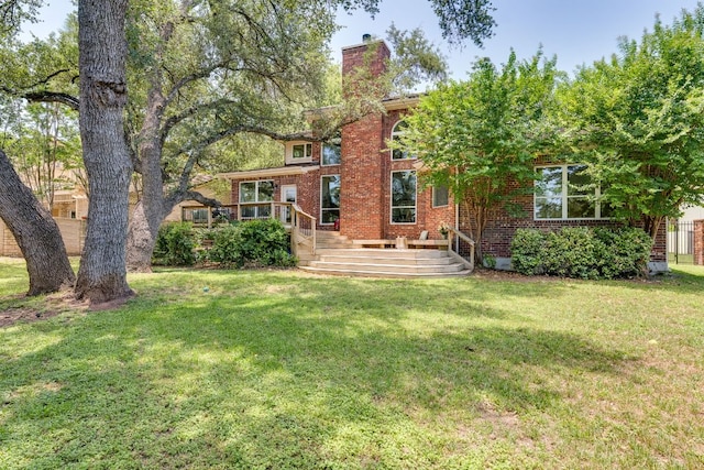 38 Cottondale Rd, The Hills, TX 78738 - back of house with a chimney, brick siding, and a deck