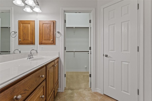 4921 Big Bend Trl, Georgetown, TX 78633 - bathroom with vanity, tile patterned floors, and a spacious closet