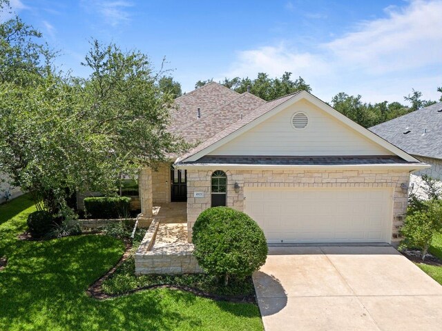 4921 Big Bend Trl, Georgetown, TX 78633 - view of front of property with a shingled roof, an attached garage, and concrete driveway
