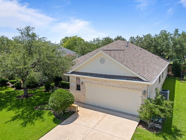 4921 Big Bend Trl, Georgetown, TX 78633 - view of front of home featuring a front yard, a shingled roof, a garage, driveway, and stone siding