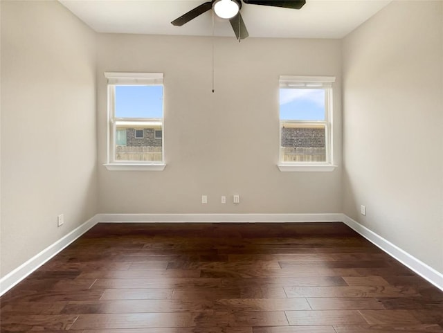 2302 Ponderosa Pass, Cedar Park, TX 78641 - empty room with plenty of natural light, dark wood finished floors, and a ceiling fan