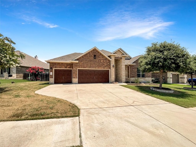 2302 Ponderosa Pass, Cedar Park, TX 78641 - view of front facade with brick siding, a garage, a front lawn, concrete driveway, and roof with shingles