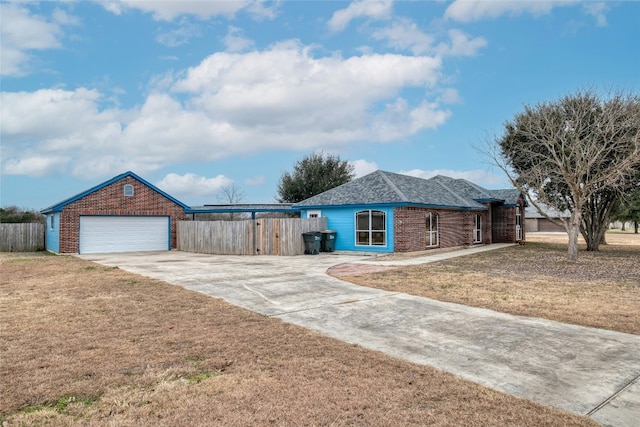233 Thomas Dr, Martindale, TX 78655 - single story home featuring driveway, brick siding, and a garage