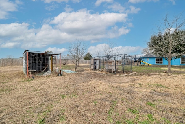 233 Thomas Dr, Martindale, TX 78655 - view of yard featuring exterior structure and an outdoor structure
