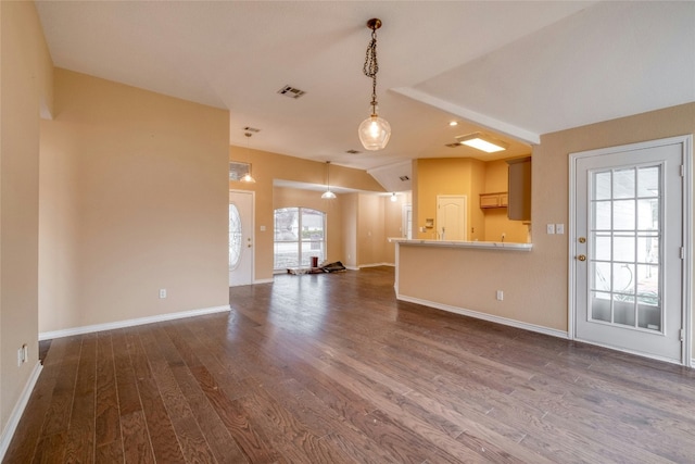 233 Thomas Dr, Martindale, TX 78655 - unfurnished living room with dark wood-style flooring and baseboards