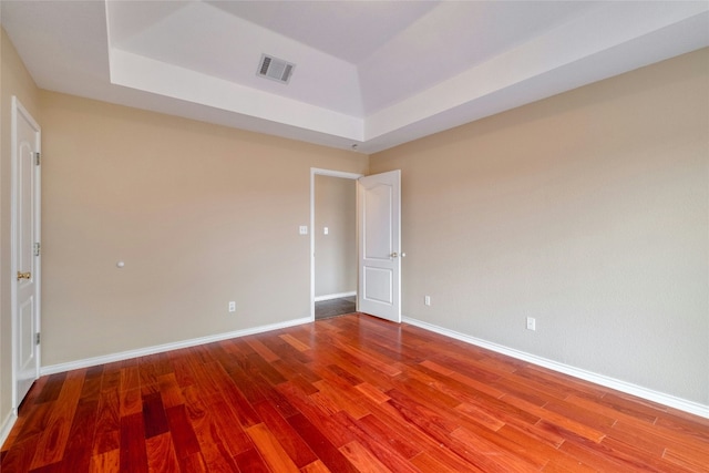 233 Thomas Dr, Martindale, TX 78655 - spare room with wood finished floors and a tray ceiling